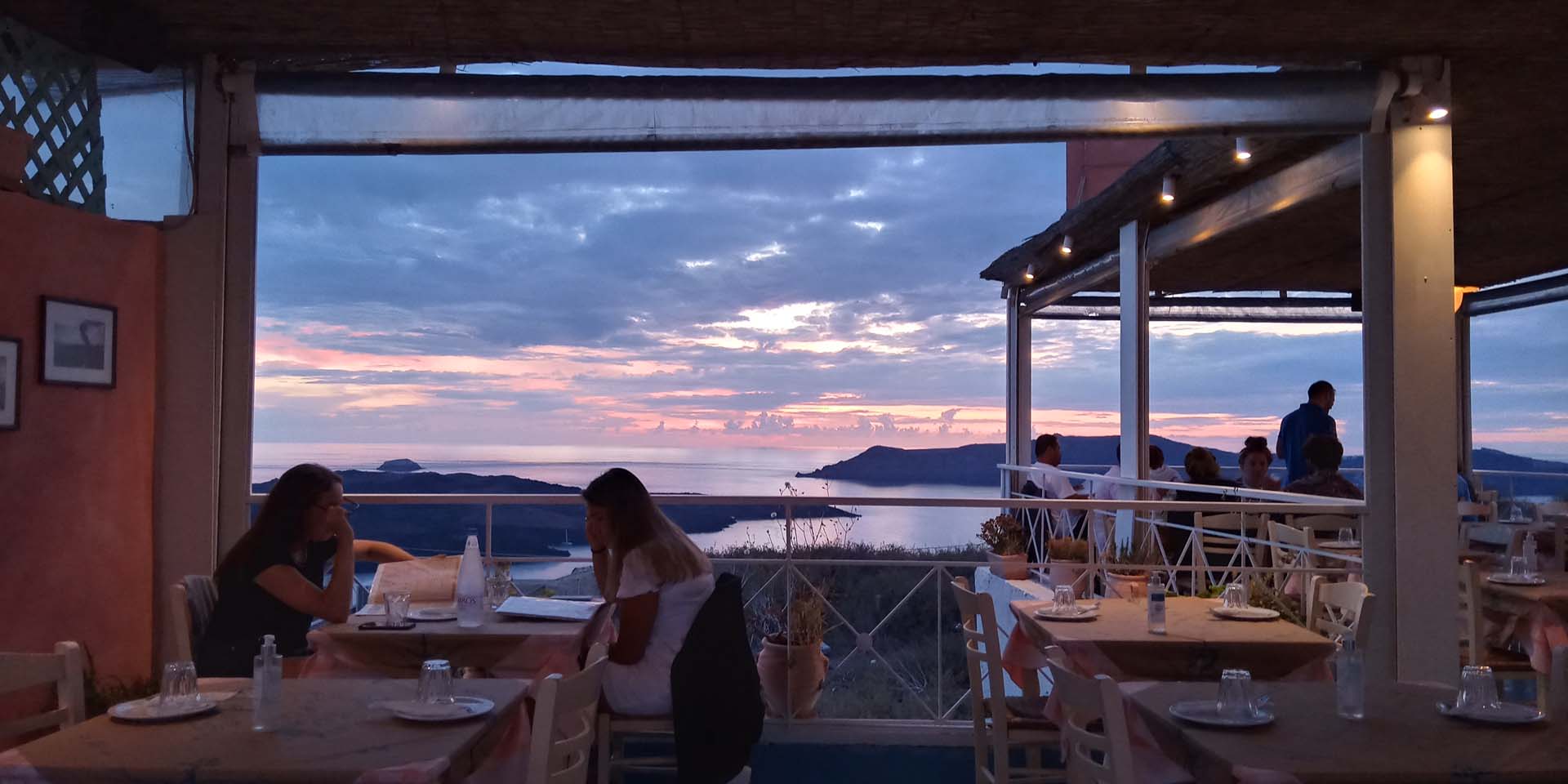Stani terrace overlooking the Santorini caldera at sunset